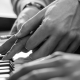 Woman learning to play piano